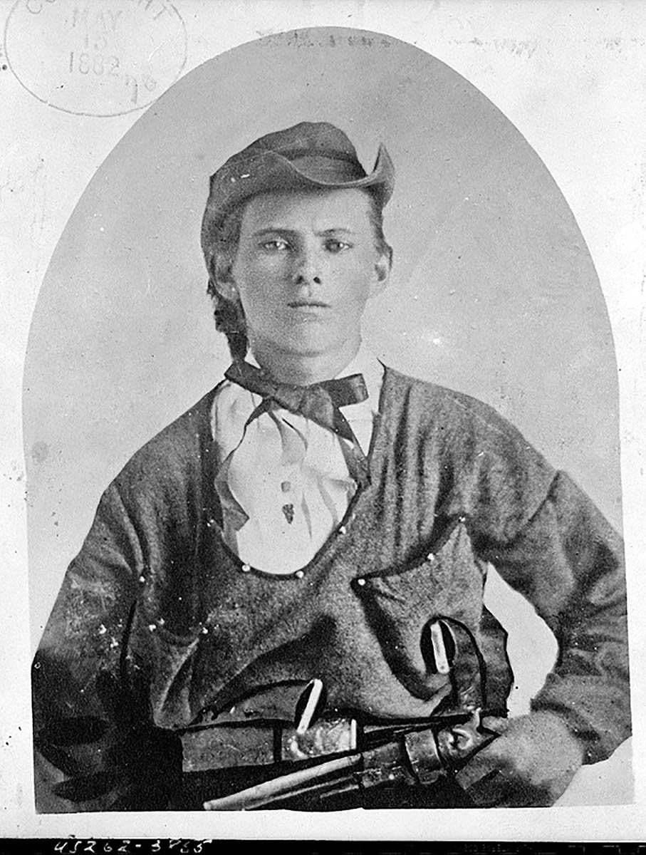 Jesse James at the age of 16, pictured with three Colt 1851 Navy revolvers.